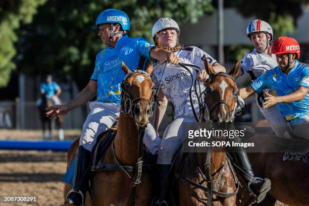 Argentina's Juan Perez, from Sierra de los Padres and France's Charlotte Laguerre of Team Simone , seen in action during the Open Horseball Argentina...