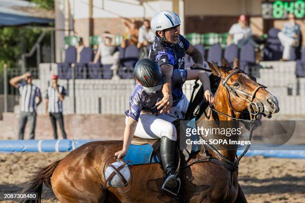The Argentinian Nicola Taberna of team Cavalier and Spain's Marian of team A&R, seen in action during the final of the Open Horseball Argentina held...