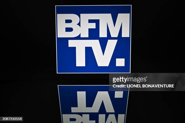 The logo of French television news channel BFM TV is displayed on a tablet screen, in Toulouse, on March 17, 2024.