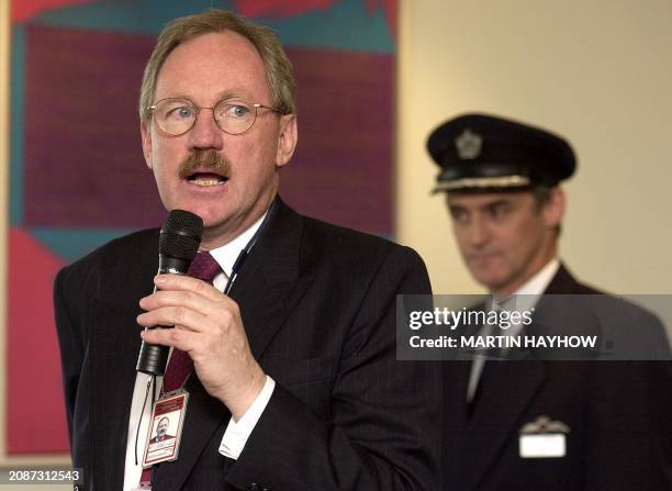British Airways Chief Executive Rod Edington speaks prior to the take off from Heathrow of one of the final Concorde's, 24 October 2003, behind is...