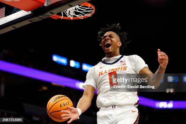 Terrence Shannon Jr. #0 of the Illinois Fighting Illini celebrates his dunk against the Ohio State Buckeyes in the first half at Target Center in the...