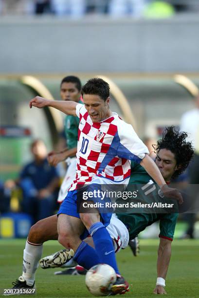 June 3: Niko Kovac of Croatia and Braulio Luna of Mexico challenge during the FIFA World Cup Finals 2002 Group G match between Croatia and Mexico at...