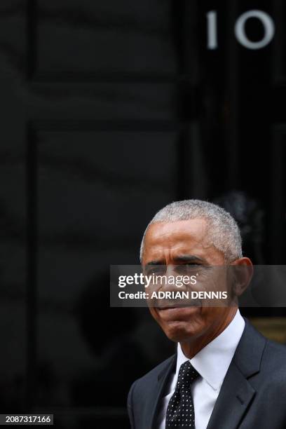 Former US President Barack Obama reacts as he leaves 10 Downing Street in central London, on March 18 following a meeting with Britain's Prime...