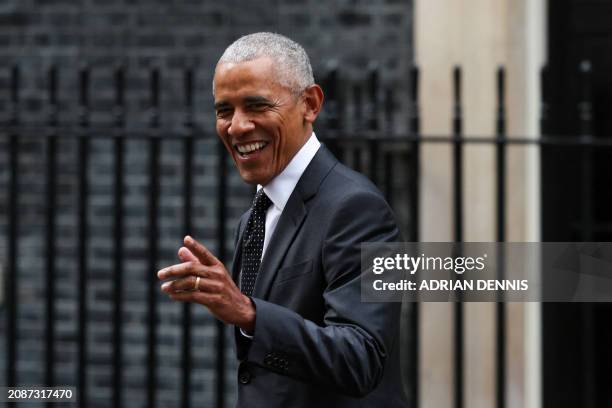 Former US President Barack Obama reacts as he leaves 10 Downing Street in central London, on March 18 following a meeting with Britain's Prime...