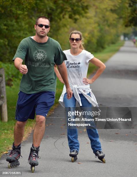 Paul and Julie Stanco of Niskayuna rollerblade on the bike path along the Mohawk River in Niskayuna Wednesday Sept. 26, 2012.