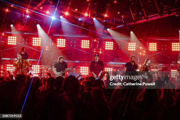 Ryan Peake of Nickelback, Justin Loose, HARDY, Chad Kroeger of Nickelback and Rhett Smith perform at CMT Crossroads: Nickelback & HARDY at Marathon...