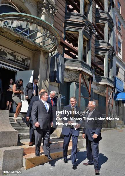 Albany Mayor Jerry Jennings, at right, leads dignitaries including NYS Lt. Gov. Robert Duffy and Albany Co. Exec Dan McCoy, left, from a tour of 138...