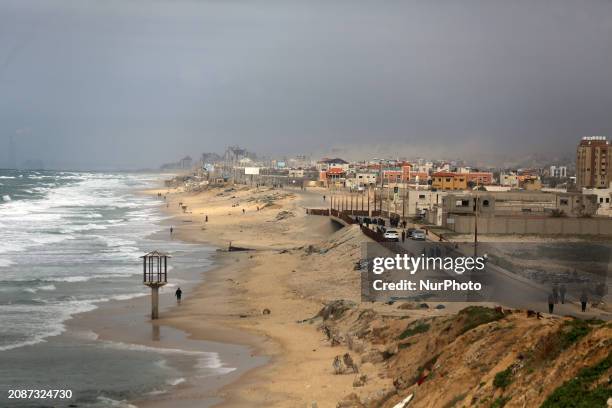 Displaced Palestinians are fleeing from the area near Gaza City's al-Shifa hospital and are walking along the coastal highway as they arrive at the...