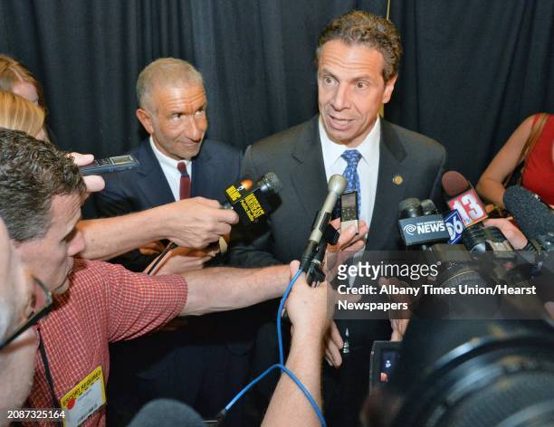 Gov. Andrew Cuomo, right, and Albany Nanocollege CEO Alain Kaloyeros speak with reporters following the announcement of a new $500 million power...