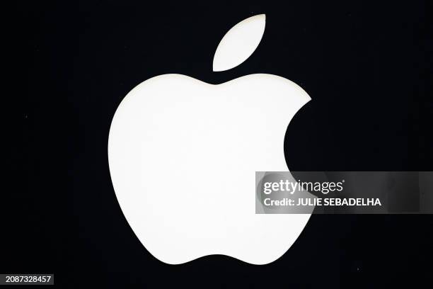 This photograph shows the logo of Apple at an Apple store on the Champs-Elysee avenue in Paris, on March 18, 2024.