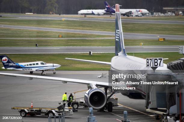 Airways jet at a boarding gate at Albany International Airport Wednesday April 22, 2015 in Colonie, NY.