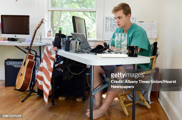 Ant Hill's head of product Matt Barth at his desk in the main office space of their Hacker House, where young entrepreneurs live and work Thursday...