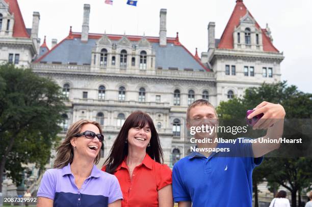 Jacob Vassalotti, right, of Newark, Delaware takes a selfie with his aunt Christy Smart of Chesapeake, Virginia, and mother Tina Vassalotti, left, in...