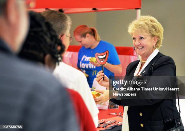 Kathie Reeher, owner of McDonalds at the Empire State Plaza hands out free Egg McMuffins during All Day Breakfast with Eggstravaganza at Empire State...