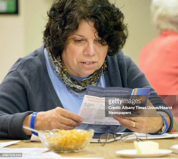 Carla Perrone of Castleton reads over an emergency supplies kit during a disaster preparedness class at Holy Spirit Lutheran Church Wednesday, Nov....