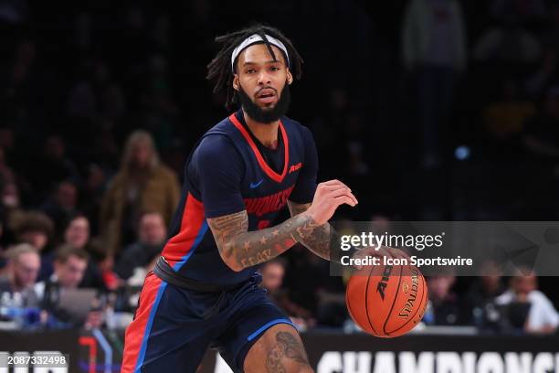 Dae Dae Grant of the Duquesne Dukes controls the ball during the Atlantic 10 Tournament Championship game against the Virginia Commonwealth Rams on...