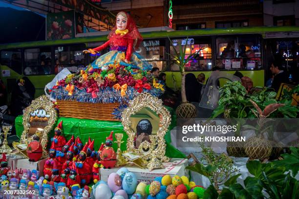 People shop at a market in Tehran on March 12 as they prepare for Nowruz, the Persian New Year. Globally, some 300 million people will wish each...