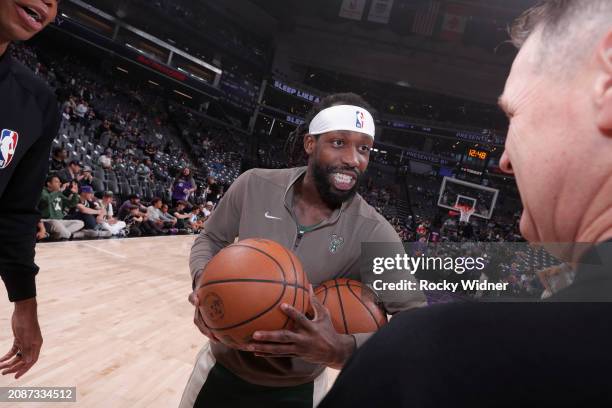 Patrick Beverley of the Milwaukee Bucks choose the game ball prior to the game against the Sacramento Kings on March 12, 2024 at Golden 1 Center in...