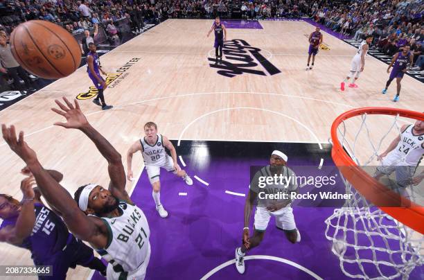 Patrick Beverley of the Milwaukee Bucks goes for the rebound during the game against the Sacramento Kings on March 12, 2024 at Golden 1 Center in...