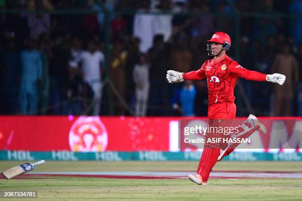Islamabad United's Hunain Shah celebrates his team's victory at the end of the Pakistan Super League Twenty20 cricket final match between Islamabad...