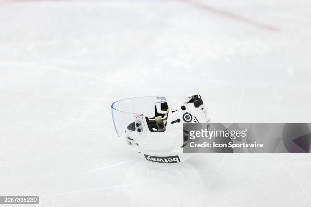 Ottawa Senators helmet lays on the ice during third period National Hockey League action between the Carolina Hurricanes and Ottawa Senators on March...