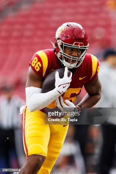 Woods of the USC Trojans runs after the catch during a game against the UCLA Bruins at United Airlines Field at the Los Angeles Memorial Coliseum on...