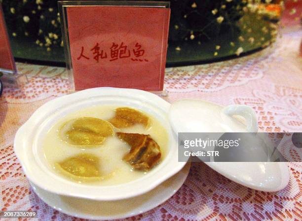 Dish of "breast milk abalone" awaits customers at a restaurant in Changsha, capital of southern China's Hunan Province, 25 January 2003. The new...