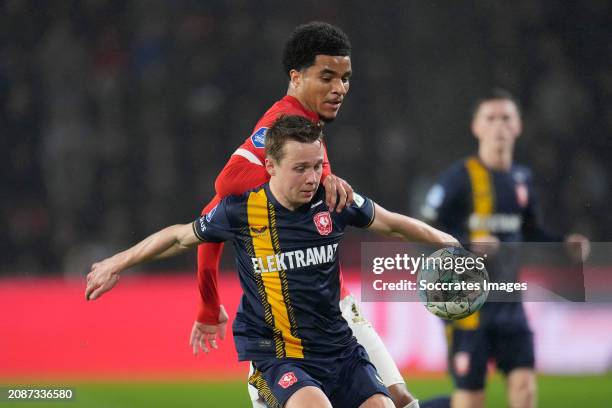 Malik Tillman of PSV, Mathias Kjolo of FC Twente during the Dutch Eredivisie match between PSV v Fc Twente at the Philips Stadium on March 17, 2024...