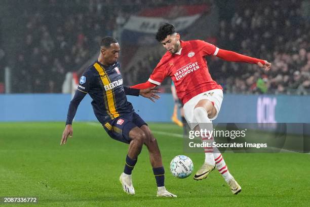 Joshua Brenet of FC Twente, Ricardo Pepi of PSV during the Dutch Eredivisie match between PSV v Fc Twente at the Philips Stadium on March 17, 2024 in...