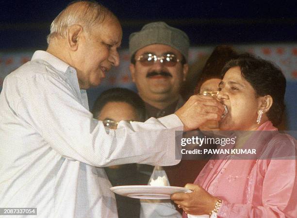 Bahujan Samaj Party chief Kanshiram offers a piece of cake to Uttar Pradesh state Chief Minister Mayawati on her birthday, 15 January 2003 in...