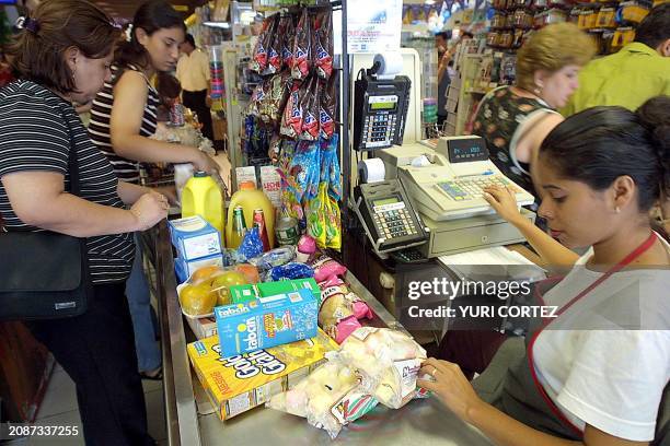 Two women are seen stocking up on food as a threat of violence lingers in the air before the coming elections in Managua, Nicaragua 03 November 2001....