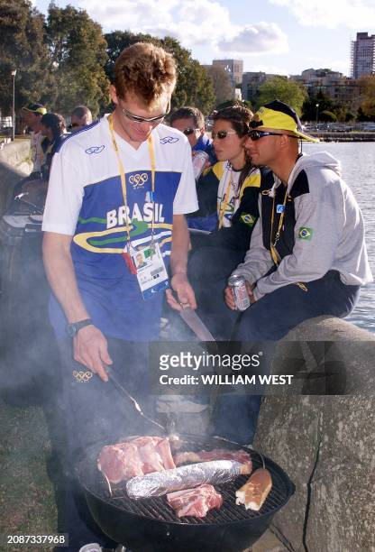 Members of the Brazilian sailing team enjoy a traditional Australian barbecue after training on Sydney harbour in preparation for the Sydney 2000...
