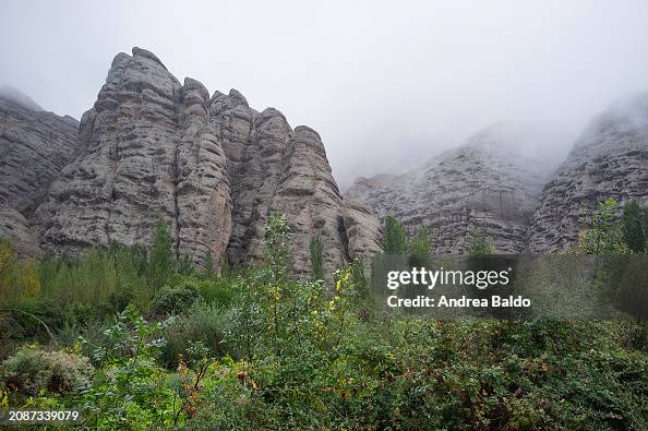 The rugged peaks of Alamut Valley are shrouded in fog in...