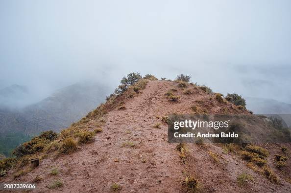 The rugged peaks of Alamut Valley are shrouded in fog in...