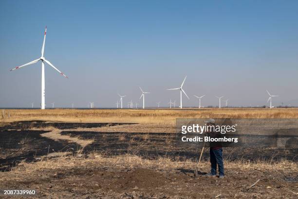 Wind turbines operated by Beijing Energy Group Co. In the outskirts of Beijing, China, on Thursday, March 14, 2024. China's ambition of delivering...