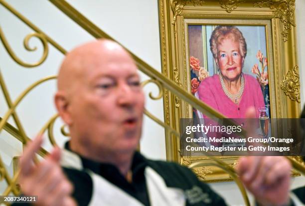 Chef Bruno Serato's mother, Caterina, hangs on the wall as he celebrates serving his 10 millionth meal to Southern California's needy children at the...