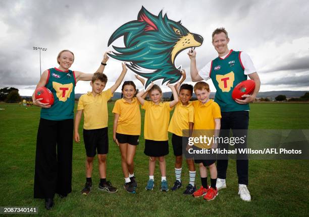 Emma Humphries and Jack Riewoldt pose for a photograph with Campbell Town District High School students Charlie, Satsuki, Winnie, Linus and Patrick...