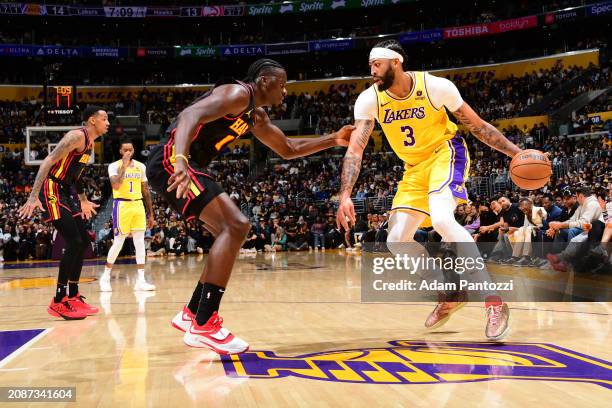 Clint Capela of the Atlanta Hawks plays defense during the game against Anthony Davis of the Los Angeles Lakers on March 18, 2024 at Crypto.Com Arena...