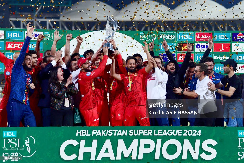 Islamabad United s Players Hold The Pakistan Super League Trophy As islamabad-united-s-players-hold-the-pakistan-super-league-trophy-as