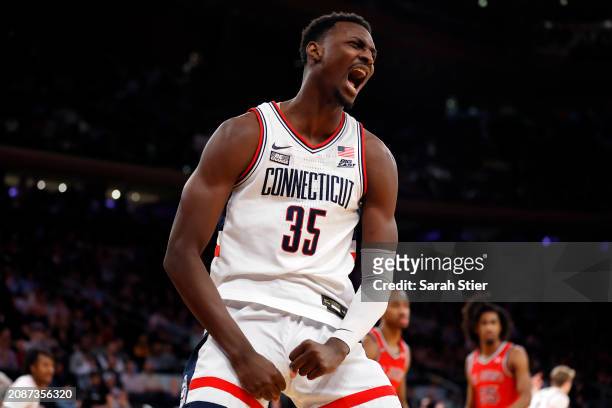 Samson Johnson of the Connecticut Huskies reacts after scoring in the second half against the St. John's Red Storm during the Semifinal round of the...