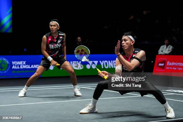 Fajar Alfian and Muhammad Rian Ardianto of Indonesia compete in the Men's Doubles Quarter Finals match against Lee Yang and Wang Chi-Lin of Chinese...