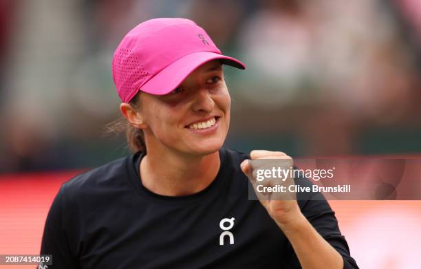 Iga Swiatek of Poland celebrates after her straight sets victory against Marta Kostyuk of the Ukraine in their Semifinal during the BNP Paribas Open...