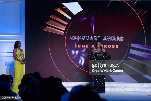 June Ambrose accepts the Vanguard Award from Kelly Rowland during the NAACP Fashion Show at Vibiana on March 15, 2024 in Los Angeles, California.