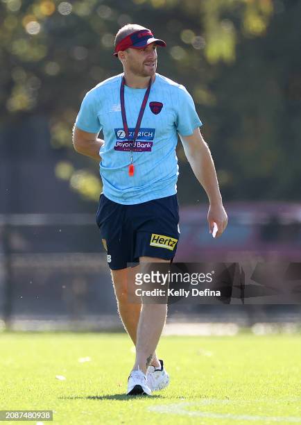 Simon Goodwin, Senior Coach of the Demons looks on during a Melbourne Demons AFL training session at Gosch's Paddock on March 16, 2024 in Melbourne,...