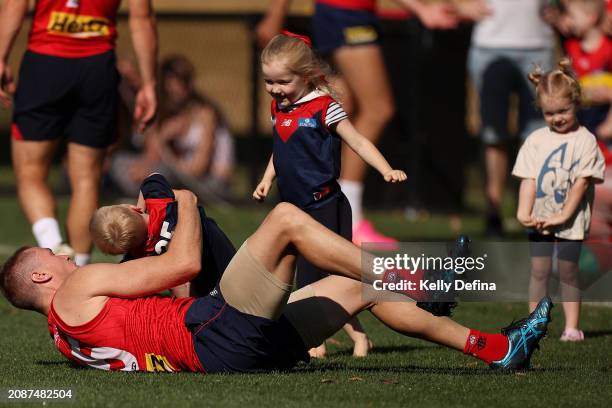 Tom McDonald of the Demons is seen with his kids after a Melbourne Demons AFL training session at Gosch's Paddock on March 16, 2024 in Melbourne,...