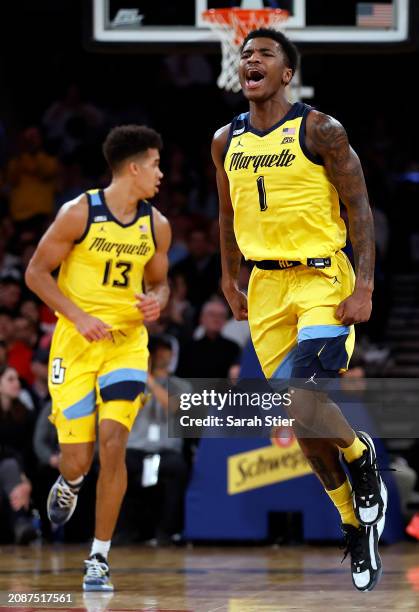 Kam Jones of the Marquette Golden Eagles reacts in the first half against the Providence Friars during the Semifinal round of the Big East Basketball...