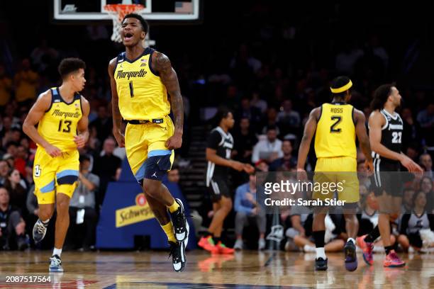 Kam Jones of the Marquette Golden Eagles reacts in the first half against the Providence Friars during the Semifinal round of the Big East Basketball...
