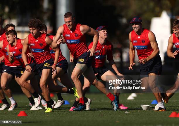 Demons player in action during a Melbourne Demons AFL training session at Gosch's Paddock on March 16, 2024 in Melbourne, Australia.