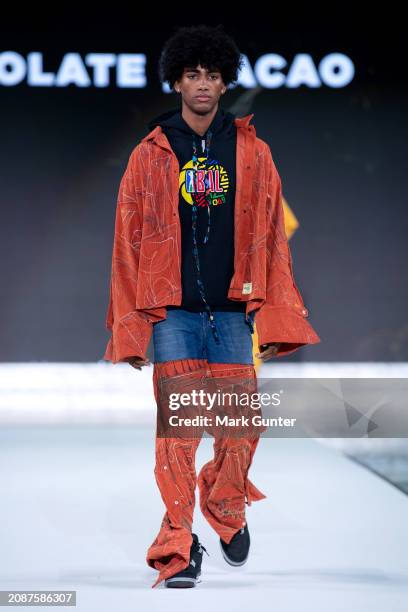 Model walks the runway wearing Chocolate Clothes Global for the NAACP Fashion Show at Vibiana on March 15, 2024 in Los Angeles, California.