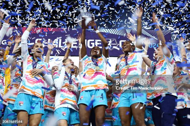 Naomi Girma of San Diego Wave FC hoists the NWSL Challenge Cup trophy after defeating NJ/NY Gotham FC at Red Bull Arena on March 15, 2024 in...
